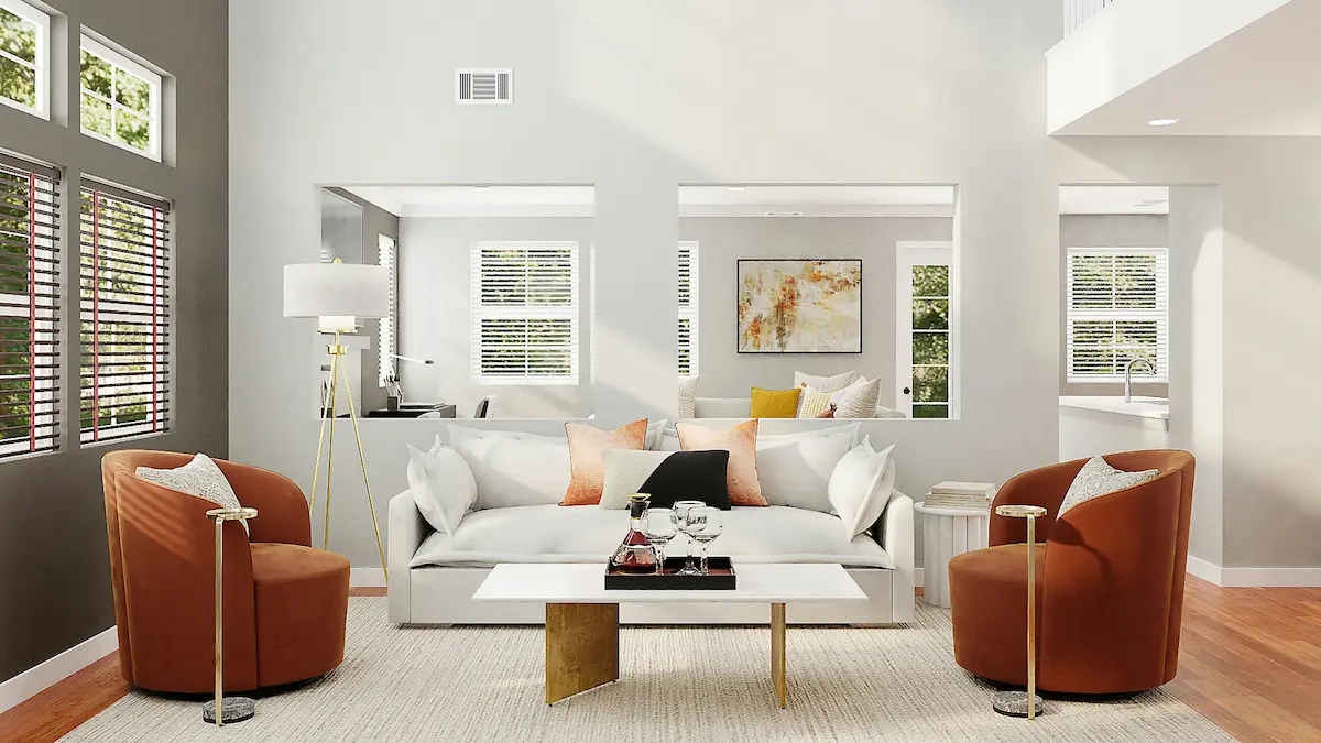 Salon lumineux avec canapé blanc et fauteuils terracotta, bien immobilier à vendre